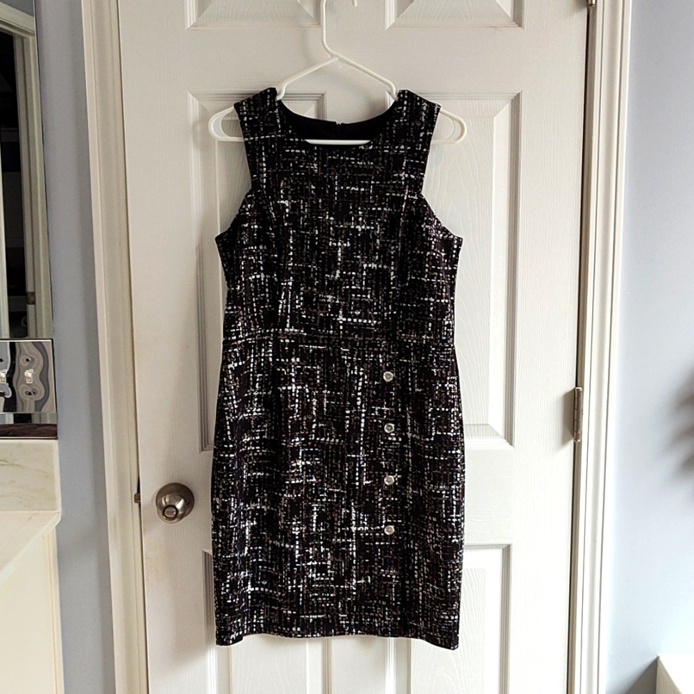 Black knee-length sleeveless dress. Stella & Julie size 12.